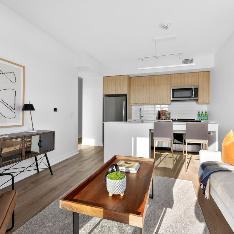 Rendering of a staged living room and kitchen at 610 Martin Grove.